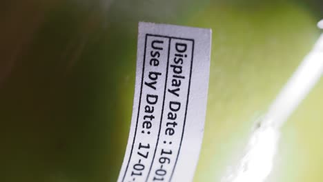 close-up of a display date label on a green candle