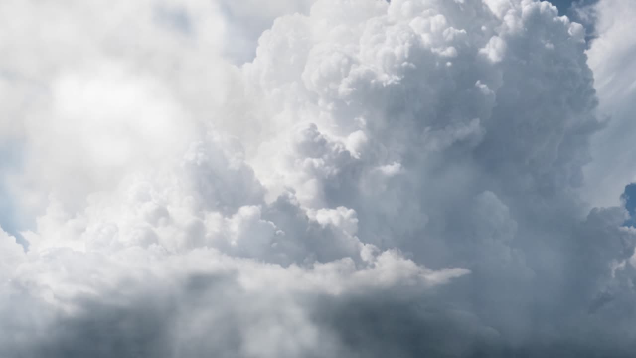 thick white cumulonimbus clouds and lightning strikes