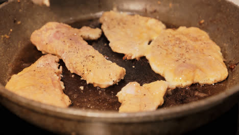 crispy chicken fillets frying in sizzling oil for flavorful home-cooked dinner