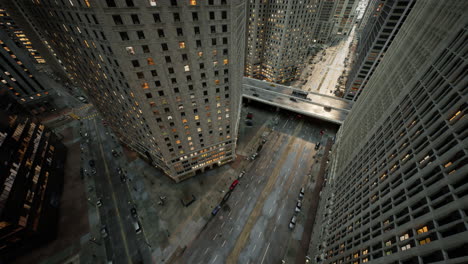 Aerial-hyperlapse-of-busy-car-traffic-in-between-Skyscrapers-city-center