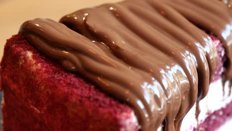 close-up of a red velvet cake with chocolate ganache