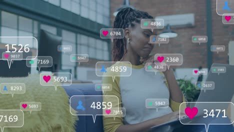 animation of social media icons over businesswoman in office