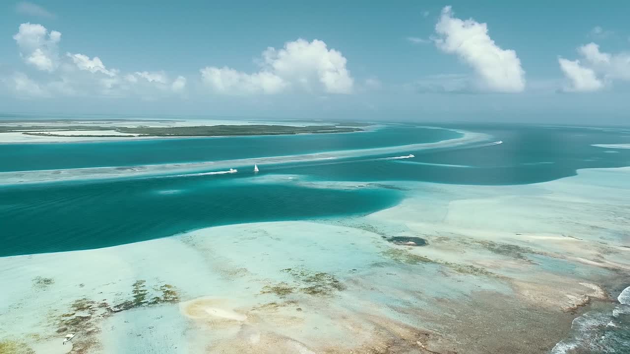 Moving-turn aerial view  beach cay  and-shallow-turquoise waters in the Caribbean sea in  SEBASTOPOL Los-roques National Park Venezuela