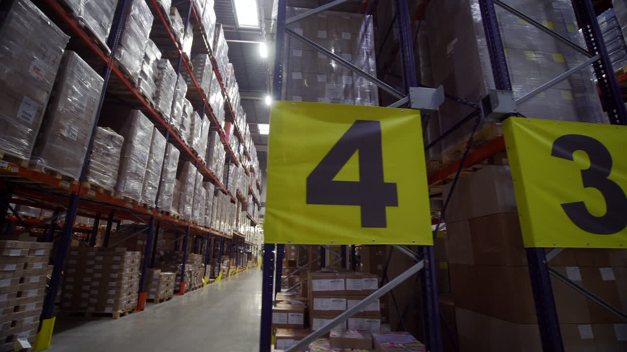 Large Warehouse Interior with Inventory and Forklift