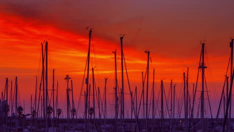 yacht port at sunrise. timelapse of yacht marina. red sky over yacht harbour