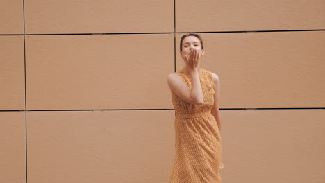 woman in yellow polka dot dress