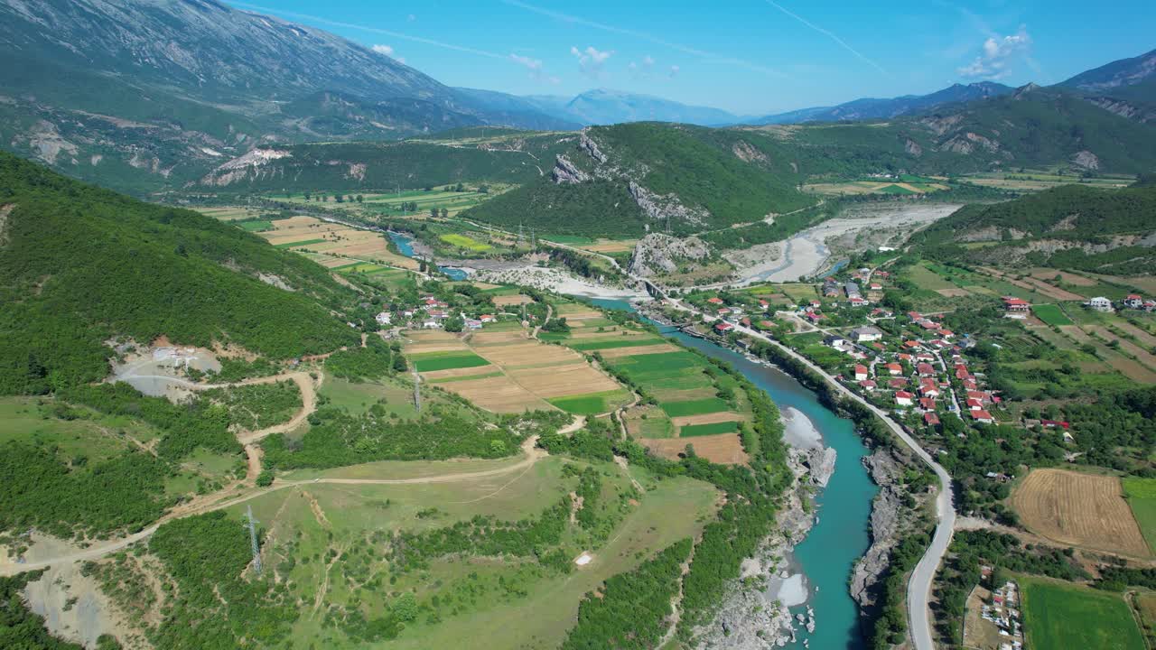 Vjosa River Peaceful Spring Countryside Farmland Landscape with Sunlit Fields and Traditional Albanian Village