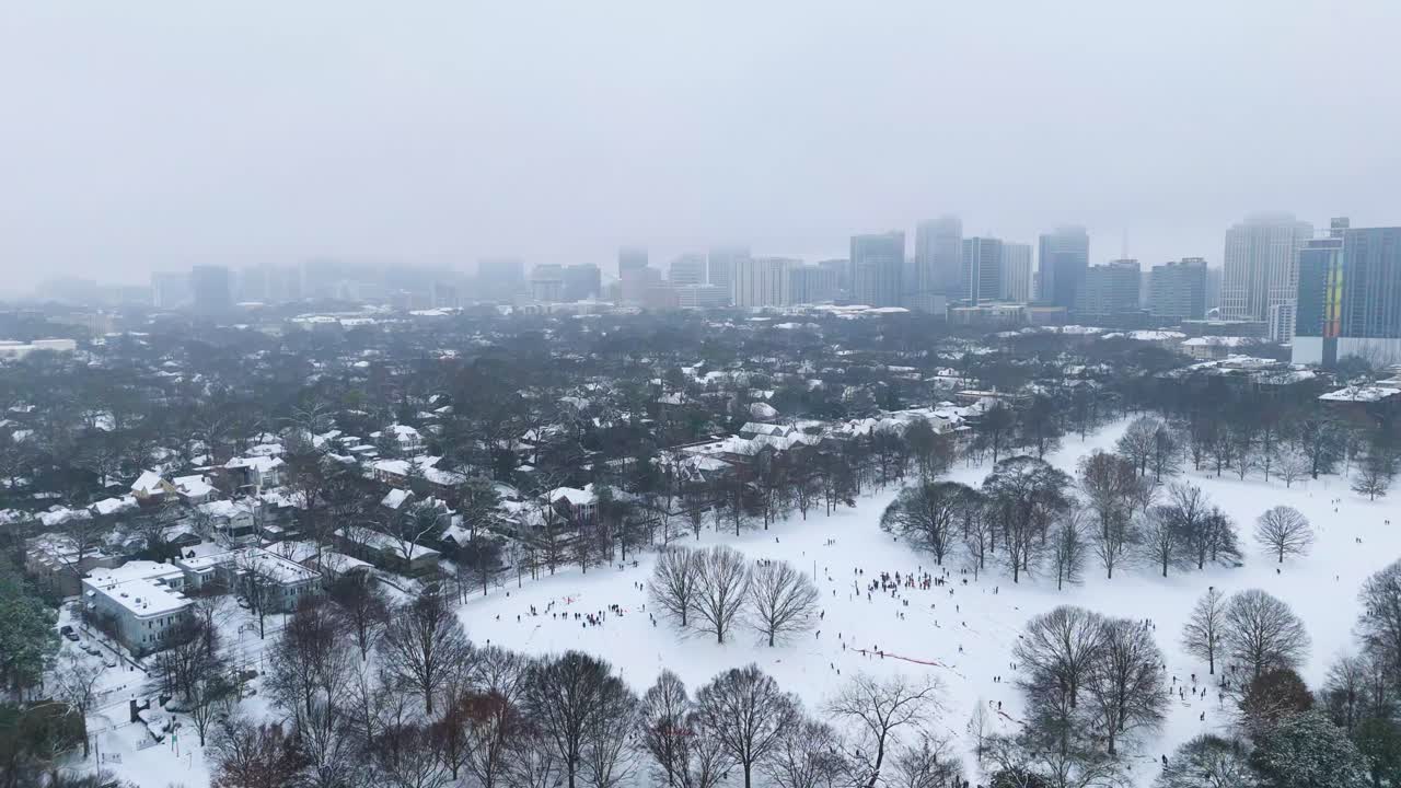 Aerial shot of snow covered Midtown suburbs in Atlanta, Georgia on January 10th 2025.
