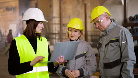 three co-workers at the factory