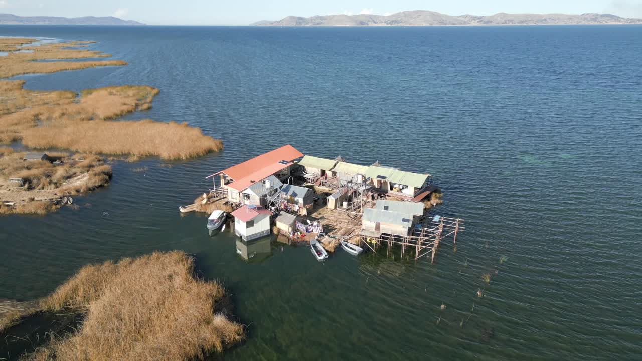 Aerial view of Uros Floating Islands on Lake Titicaca, the highest navigable lake in the world, on the border of Peru, South America