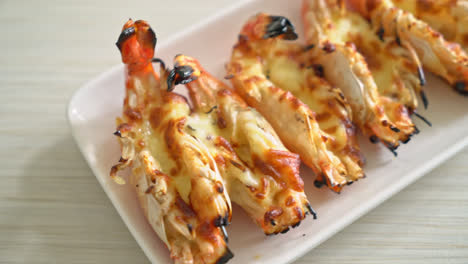 grilled river prawns or shrimps with cheese - seafood style