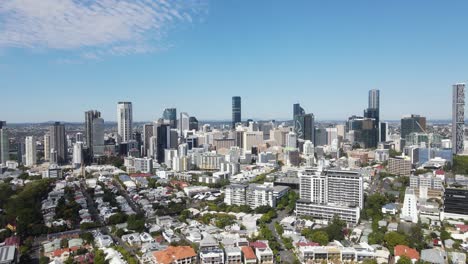 aerial views of spring hill and fortitude valley with the towering skyline of the brisbane city central business district.