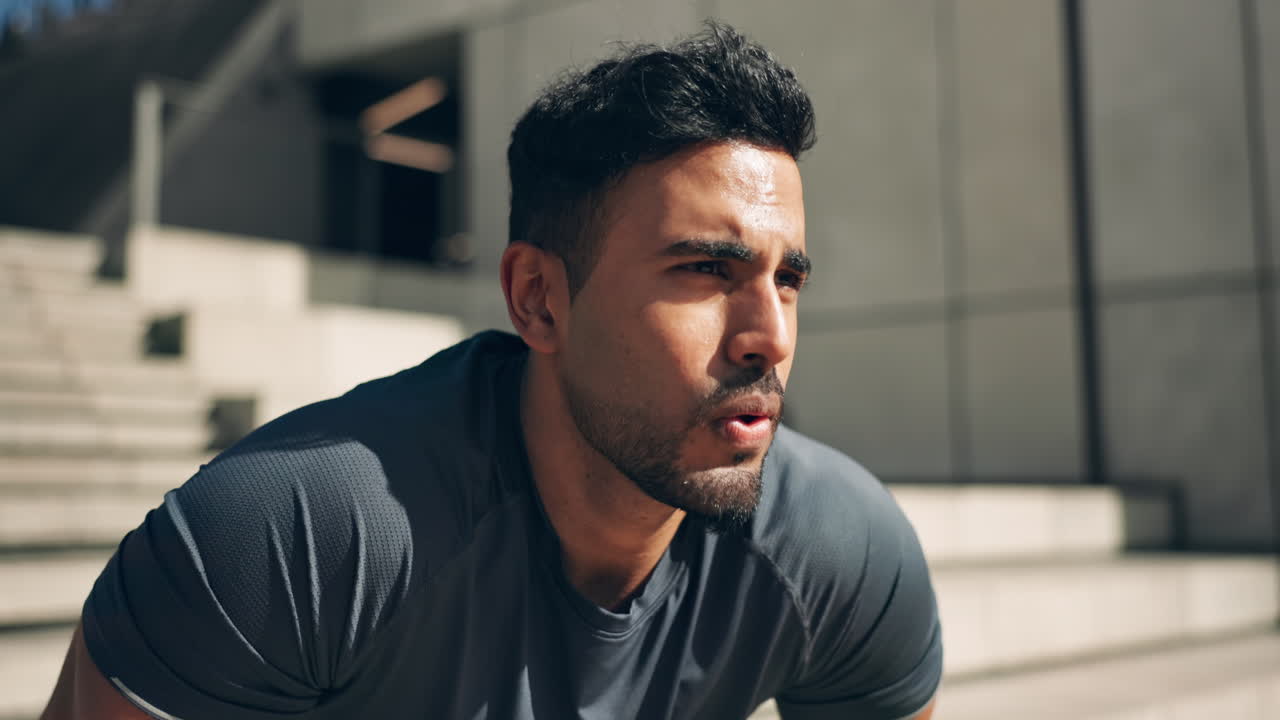 Face, man and deep breathe from workout