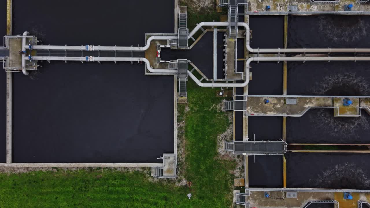 Water treatment facility with tanks and machinery at work