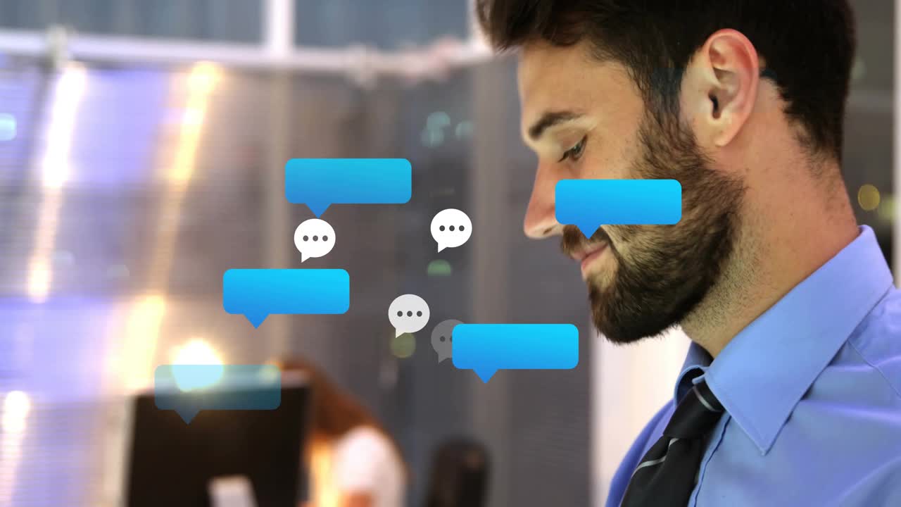 Man shifting tablet while checking messages, causing chat bubbles clustering around him in office