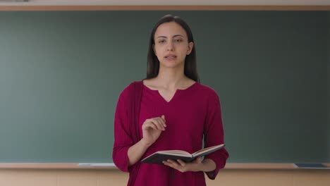 Happy-Indian-female-teacher-solving-student-problem