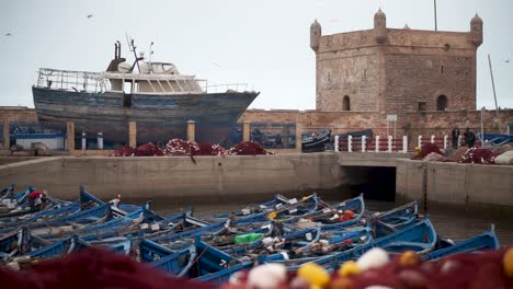Fishing-boats-all-gathered-in-port-area-with-fortress-standing-above