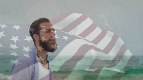 animación de la bandera de los estados unidos de américa sobre hombre biracial sobre hombre caucásico feliz en la playa