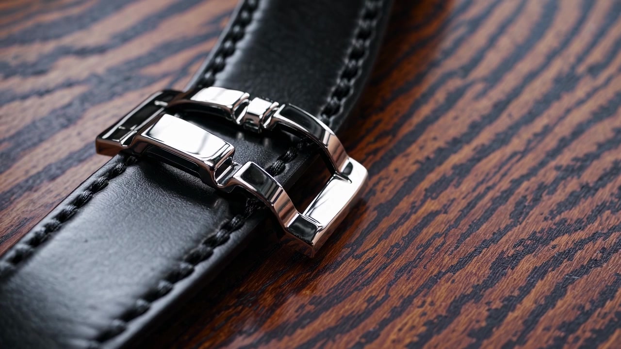 Close-up of a Black Leather Watch Strap with Silver Buckle