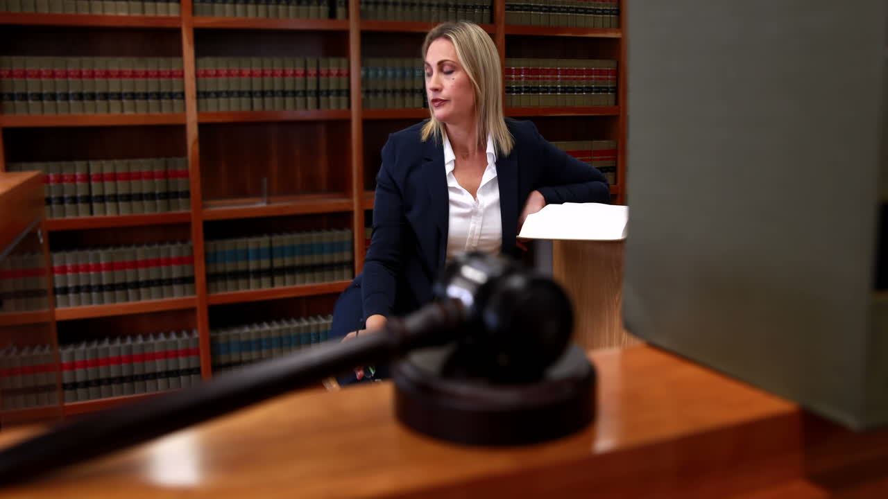 Librarian reading and noting in book