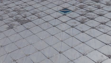 Deteriorated-Eternit-Roof-Of-An-Old-House.-Close-up