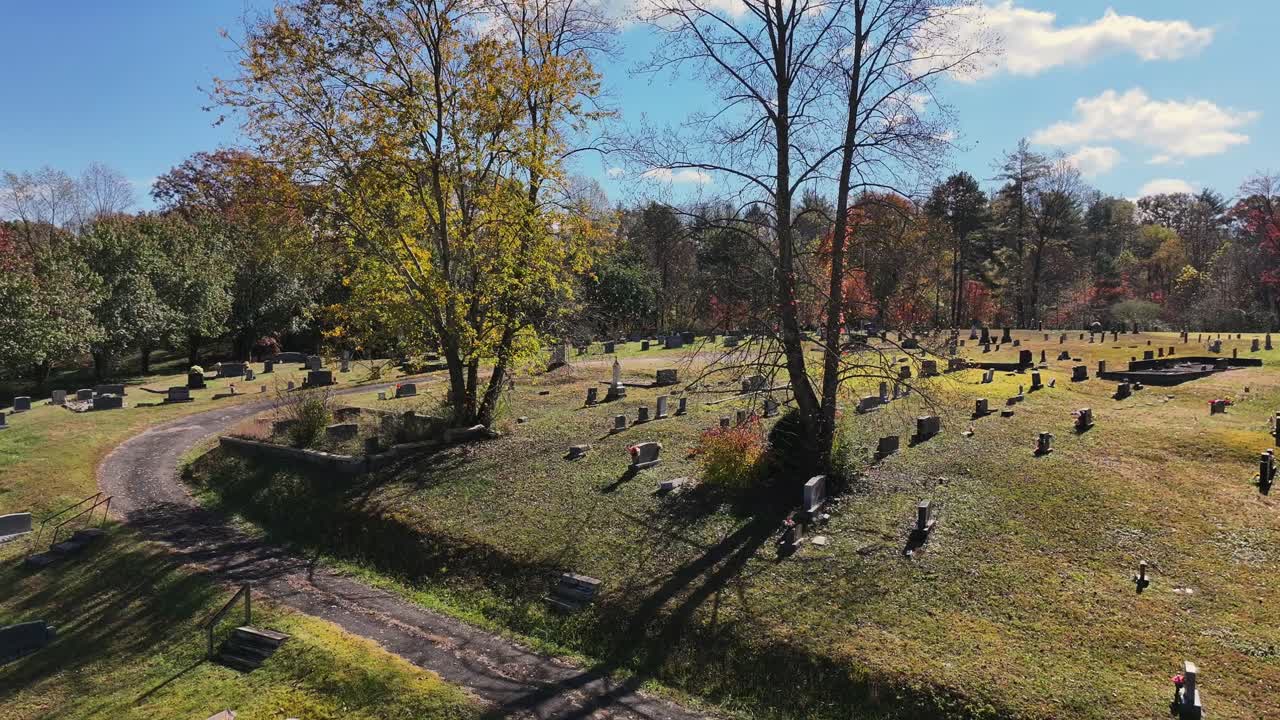 Reverse reveal of small hillside cemetery in North Carolina