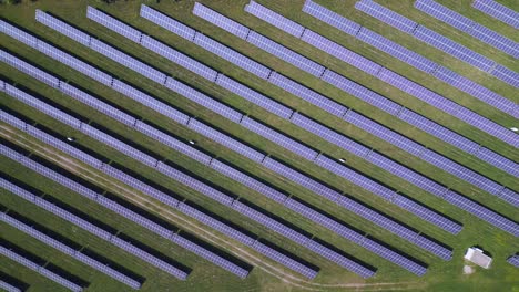 Great-aerial-top-view-flight-Solar-field-plant-factory-at-village-Chlum,-Czech-Republic-Summer-2023