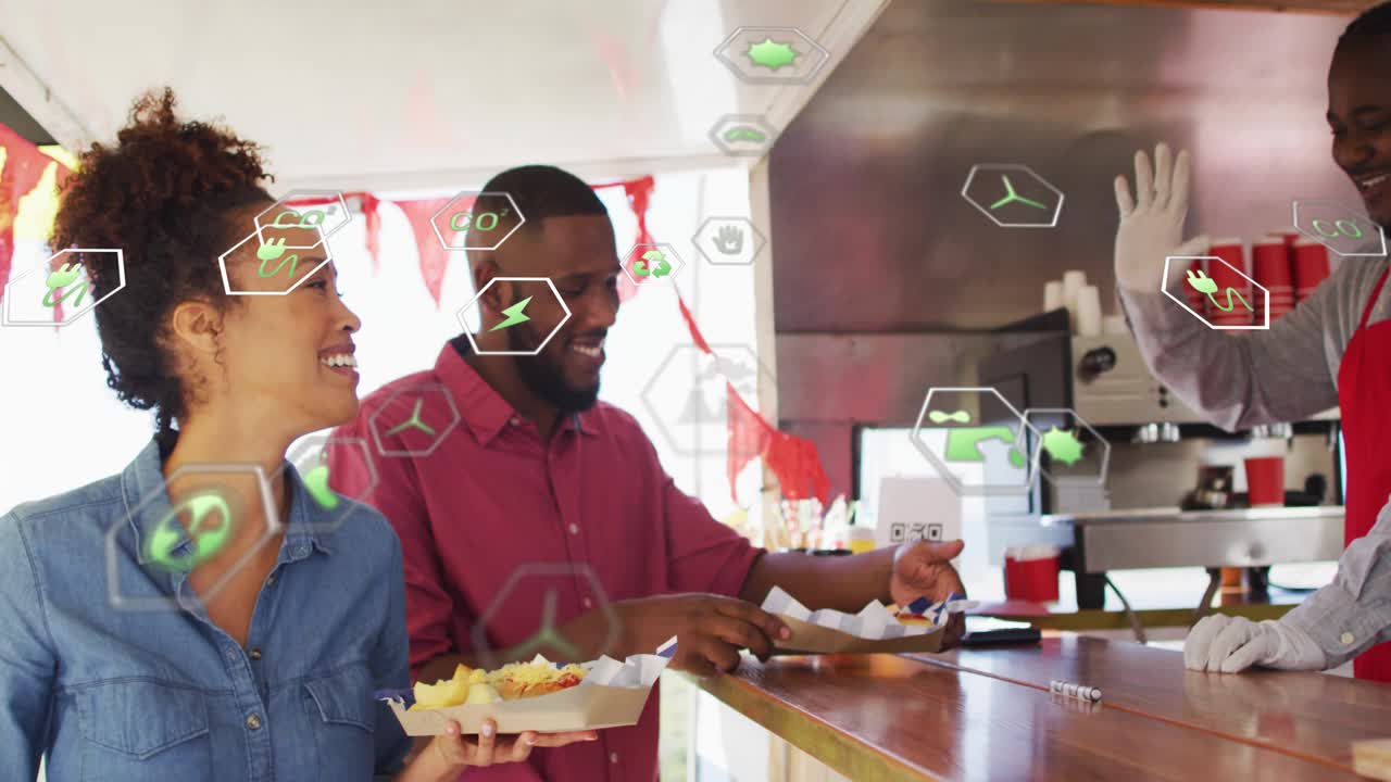 Food-truck vendor scooping chips into tray as man scanning QR code to pay under green icons