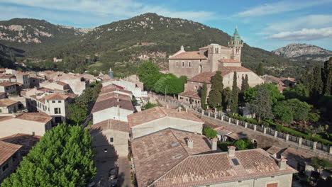 historic building of royal charterhouse within the town of valldemossa in mallorca, spain