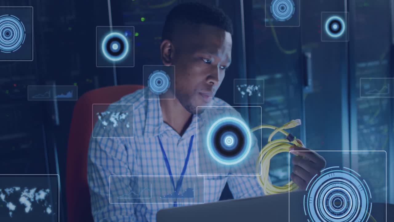 Animation of processing circles floating over african american man working in server room