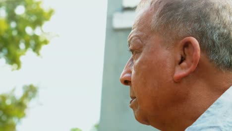 senior man relaxing in garden