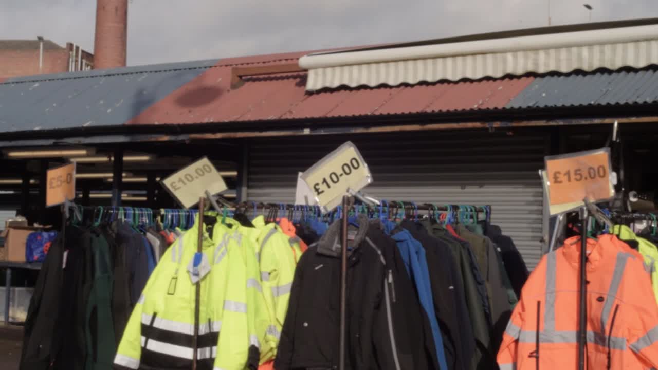 View of rows of hi vis work wear jackets for sale in British outside market