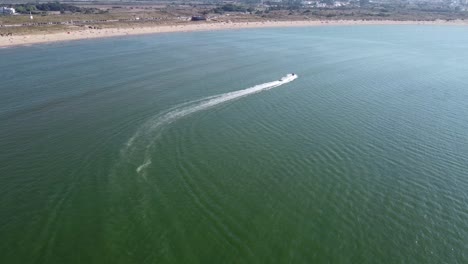 Aerial View of Jet Ski Towing Inner Tube of Coast in São Martinho do Porto, Portugal