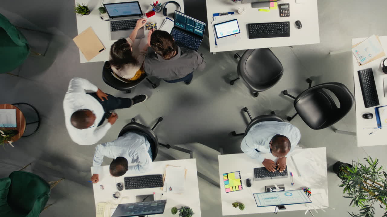 Top down view zoom in of employees collaborating on planning business strategy