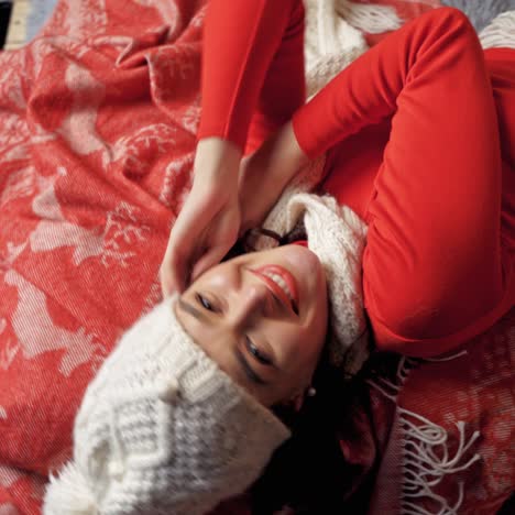 charming woman laying on bed smiling and posing. lady looking at camera. new year video