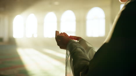 a person praying in a mosque