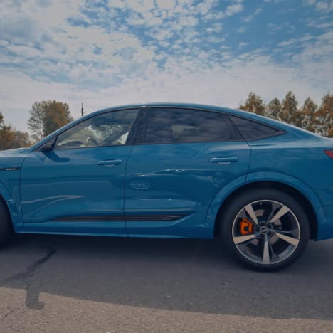 audi e-tron sportback luxurious car. side view of audi e-tron electric car on road