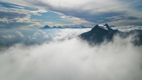 mystical aerial view from above the clouds, showcasing the stunning mountains of calpe, spain