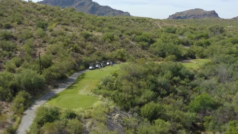 Golfer-driving-golf-ball-onto-fairway