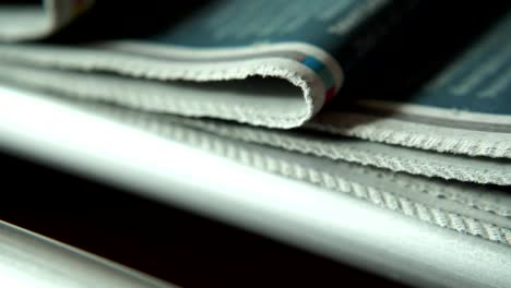 printed newspapers on a factory line