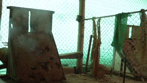 tejo field, colombian national sport. tejos falling on the court with clay and exploding a wick of gunpowder. static