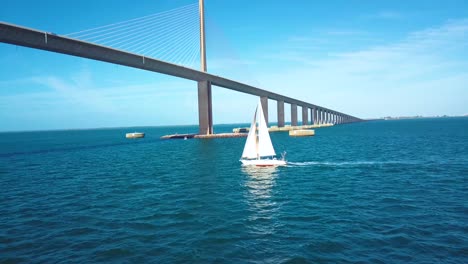 4k aerial slo-mo video of sailboat in tampa bay, florida