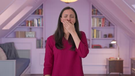 tired and lazy indian woman yawning and relaxing