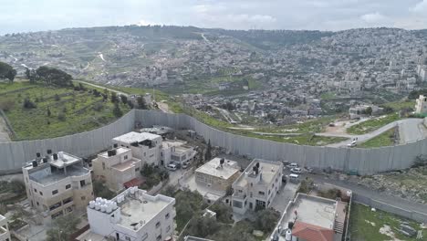 aerial footage of the separation wall between israel and the palestinian authority in jerusalem