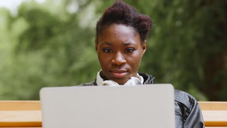 woman working on a laptop outdoors