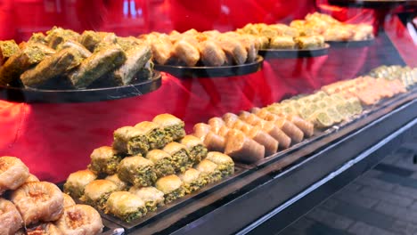 closeup of a bakery display with various baklava and other turkish sweets