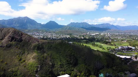 aerial fly-backwards shot of stunning mountainous oahu, hawaii