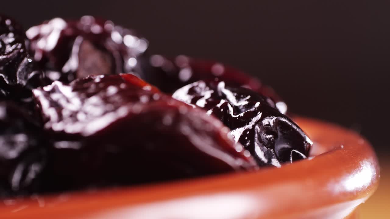 Dried Plums in a Bowl