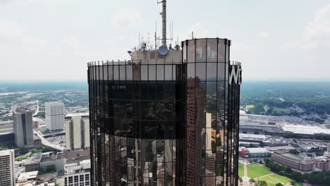 Aerial-cinematic-footage-of-top-floors-of-Westin-Peachtree-Plaza-hotel