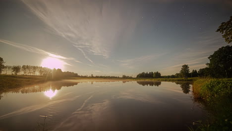 Time-lapse-of-night-sky-and-stars-moving-quickly-over-lake-water